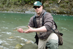 fisherman with bull trout photo