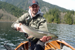 fisherman with rainbow trout photo