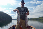 fisherman holding two big rainbow trout photo