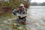 fisherman with steelhead trout photo