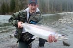 fisherman with steelhead photo